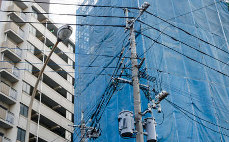 Old electricity cable near the street in Japan