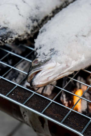 Salt-Crusted Grilled Fish, BBQ in Thai style. The famous of Thai street food in Thailandの写真素材