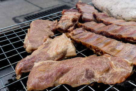 Roasted pork rib Grilled, BBQ in Thai style. The famous of Thai street food in Thailandの写真素材