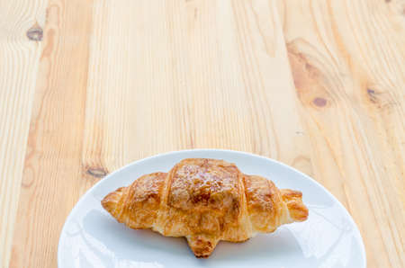 Croissant, Breaded bread on a wooden tra and white dishy delicious breakfast.の写真素材