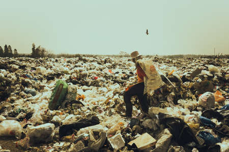 Nong Bua Lam Phu  province, THAILAND. February 5 2019. Waste from household in waste landfill and men worker.のeditorial素材
