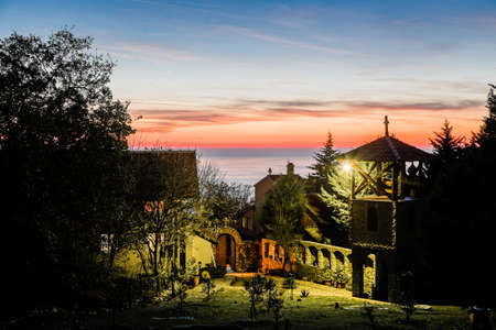 Bright sunset over the monastery on the Adriatic Sea
