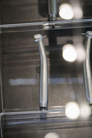 metal Dental equipment tools with blurry background . Verticalの写真素材