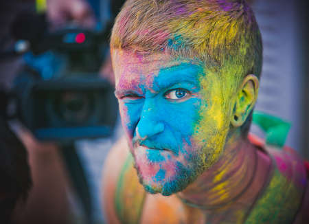 06.07.2019 moscow. russia. Happy man face close-up. holi festival.