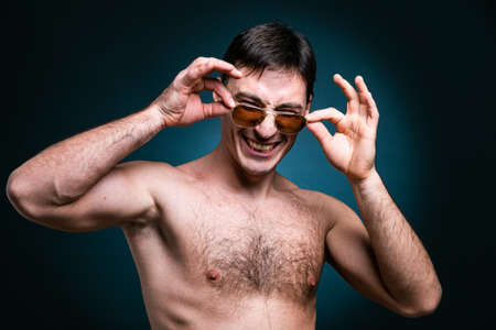 gay man athlete smiling in sunglasses youngの写真素材