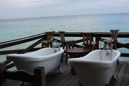 Bathtubs on beachの写真素材