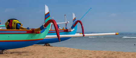 Two fisherman's boat on a sandy beach with bright colorsの写真素材