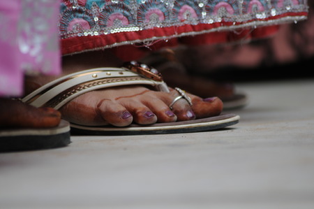 special rings and jewelry on fingers of the leg of a woman from indiaの素材 [FY31090169764]