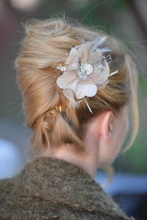 A bride on her wedding day with a white dress and hair extensions and flowers