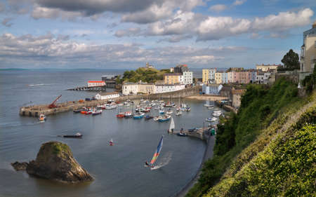 The harbour and sea front at Tenby in Wales lie well below the town. のeditorial素材