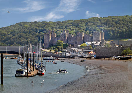 Conwy estuary harbour and 13th century castle in Wales UK.の写真素材