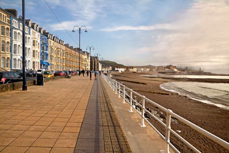Aberystwyth is a seaside resort with a long promenade, and is situated on the Welsh coast.