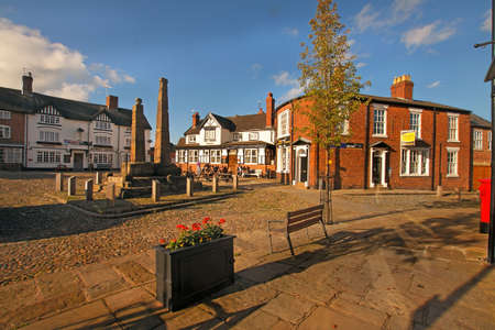 Two ninth century Anglo-Saxon crosses stand in the market square at Sandbach in Cheshire, England のeditorial素材