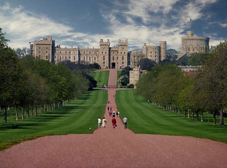 Windsor castle, seen here beyond the long walk, is in Berkshire, England, and was built in the eleventh century and is regularly used by the Royal Family のeditorial素材