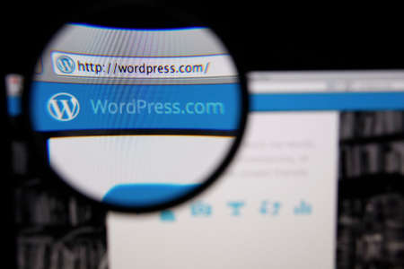 LISBON, PORTUGAL - FEBRUARY 5, 2014: Photo of WordPress.com homepage on a monitor screen through a...