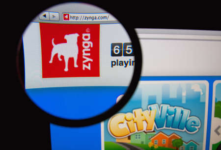 LISBON, PORTUGAL - FEBRUARY 5, 2014: Photo of Zynga homepage on a monitor screen through a...