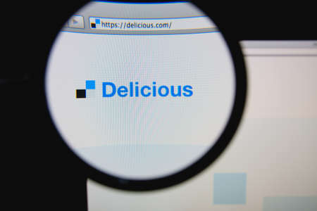 LISBON, PORTUGAL - FEBRUARY 6, 2014: Photo of Delicious homepage on a monitor screen through a magnifying glass.のeditorial素材