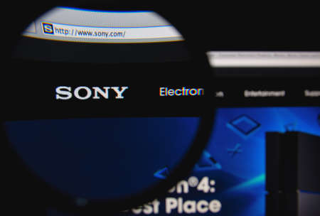 LISBON, PORTUGAL - FEBRUARY 19, 2014: Sony homepage through a magnifying glass.