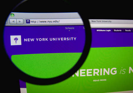 LISBON, PORTUGAL - FEBRUARY 21, 2014: Photo of the New York University homepage on a monitor screen through a magnifying glass.のeditorial素材