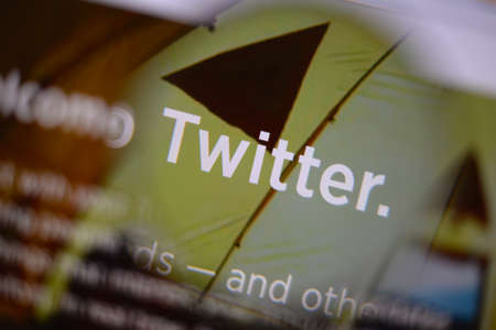 LISBON, PORTUGAL - AUGUST 3, 2014: Photo of Twitter homepage on a monitor screen through a...