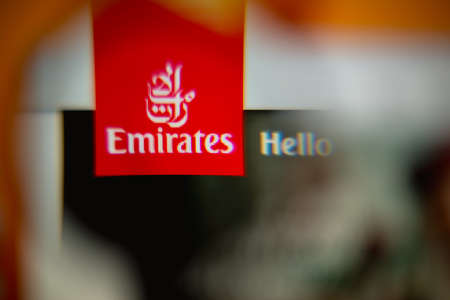 LISBON, PORTUGAL - AUGUST 27, 2014: Photo of Emirates airline homepage on a monitor screen through a magnifying glass.のeditorial素材