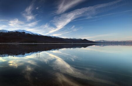 Mountain lake in background with high mountainの写真素材