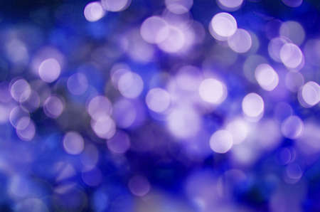Abstract holiday background, beautiful shiny Christmas lights, glowing magic bokehの写真素材
