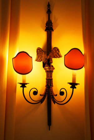 Elegant wall lamp on wooden wallの写真素材