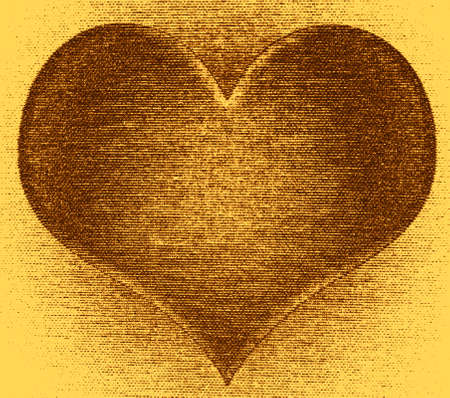 heart shaped ornament on glitter gold backgroundの写真素材