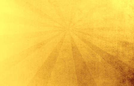 Sunburst textured gold abstract background.の写真素材