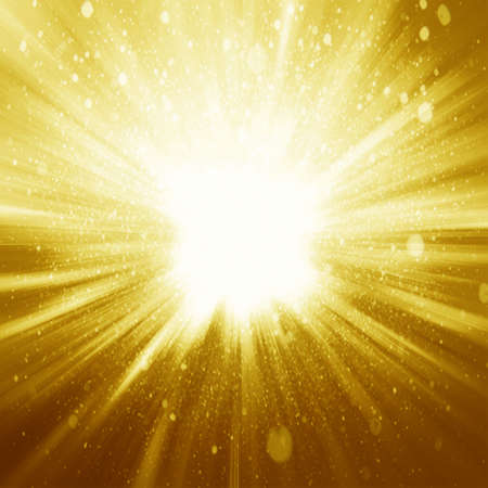 Golden sparkling background with intense glowing sparkles and glitterの写真素材