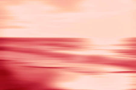 An abstract pink ocean seascape with blurred panning motion. Image displays a retro vintage look...