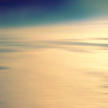 Aerial view White clouds in blue sky. Top view. View from drone. Aerial bird's eye view. Aerial top view cloudscape. Texture of clouds. View from above. Sunrise or sunset over cloudsの写真素材