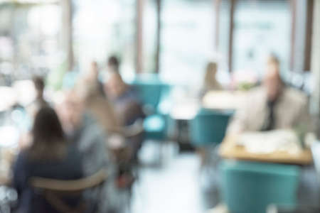 Coffee shop blur background with bokeh image . Blur restaurant, retro and vintage styleの写真素材