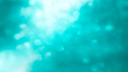 Winter seasonal bokeh background. Blue bokeh light backgrounds. Blue bubble background. Abstract...