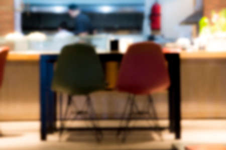 Blur restaurant - vintage effect style picture.  empty table top on of blurred background. Perspective modern table over blur in coffee shop background - can be used mock up for montage products display or design key visual layout.の写真素材