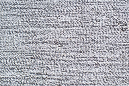 White concrete wall for interiors or outdoor exposed surface polished concrete. Cement have sand and stone tone vintage, natural patterns old antique, design work floor texture background. Concrete texture, concrete wall. Loft concrete surface weathered.の写真素材