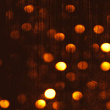 Gold Festive Christmas luxury background. Elegant abstract gold background with golden bokeh defocused lights and starsの写真素材