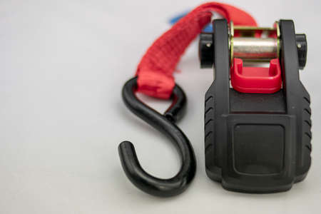 Ratchet strap with holding hook and braided belt for securing heavy loads and dangerous to transportの写真素材
