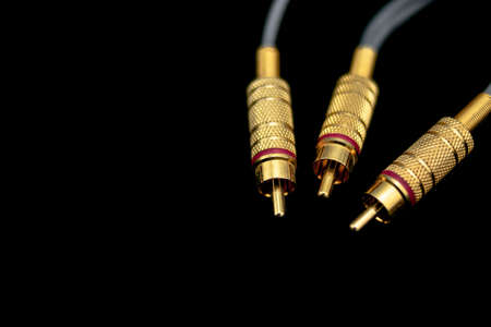 gold and metallic male rca connectors on black backgroundの写真素材