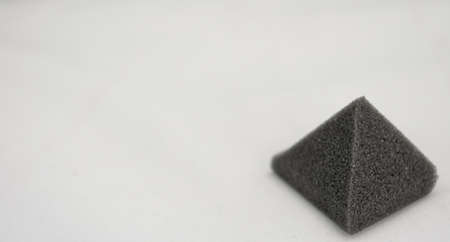 Foam pyramid isolated on white background
