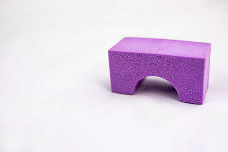 Violet foam or sponge bridge to make constructions as a toy for children