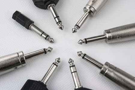 Connectors with mono and stereo jack terminals, and conversion to mini jack, male and female xlr, signal duplicators, etc. on white backgroundの写真素材