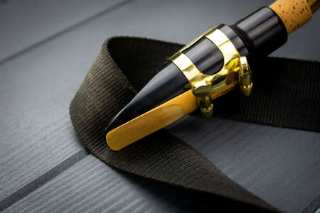 Mouthpiece of a saxophone with its reed adjusted and ready to make it sound