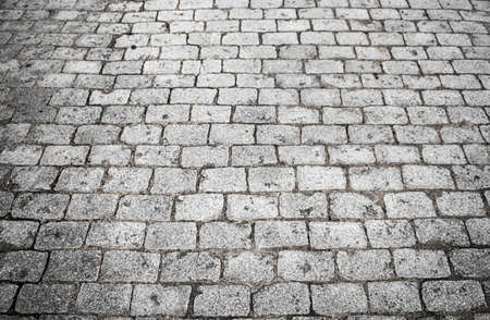 stone blocks in cobblestone format on a street with gray tones