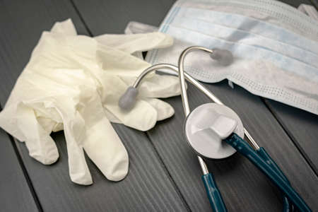 Latex gloves, safety mask and stethoscope to protect yourself and detect diseases caused by viruses and bacteriaの写真素材