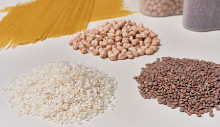Rice, lentils, chickpeas and pasta. Basic raw foods with carbohydrates for a healthy and balanced...