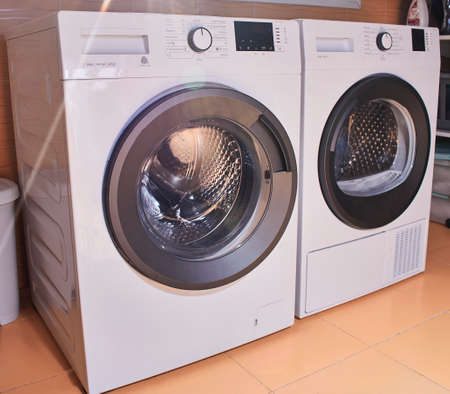 Energy-efficient, energy-efficient white goods washer and dryer located in a laundry room