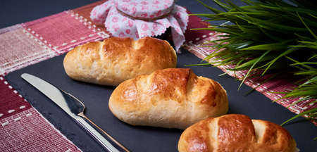 Milk Bread. Baked in the traditional style. Golden. Fluffy and delicious. With jam and a knife to...