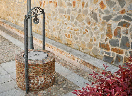 Well to extract underground water made of stone and traditional style with decorative elementsの写真素材